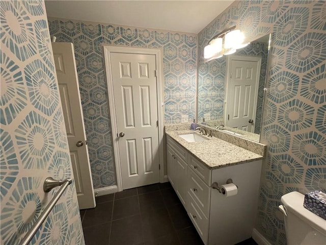 60 Saw Mill Dr Unit 303, North Kingstown, RI 02852 - bathroom with wallpapered walls, vanity, tile patterned flooring, and toilet