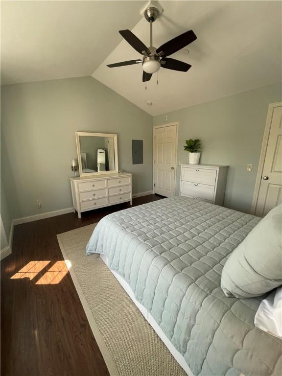 60 Saw Mill Dr Unit 303, North Kingstown, RI 02852 - bedroom with electric panel, vaulted ceiling, wood finished floors, baseboards, and a ceiling fan