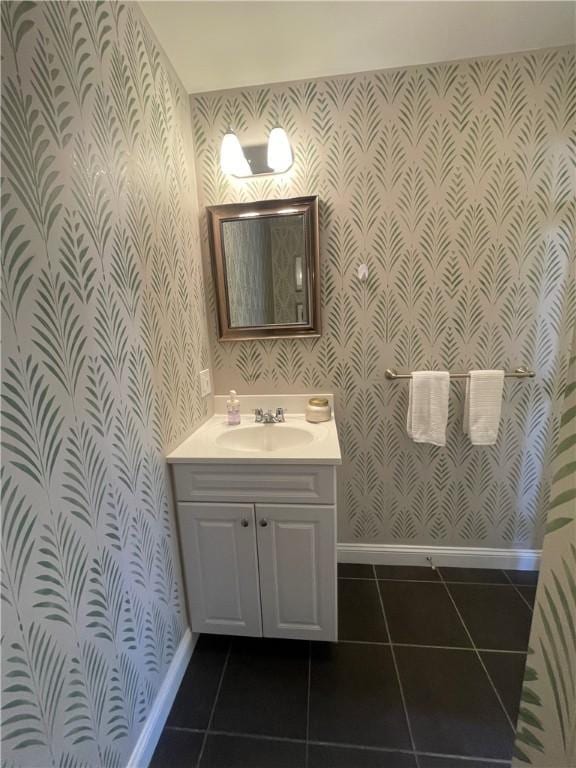 60 Saw Mill Dr Unit 303, North Kingstown, RI 02852 - bathroom featuring wallpapered walls, baseboards, vanity, and tile patterned flooring