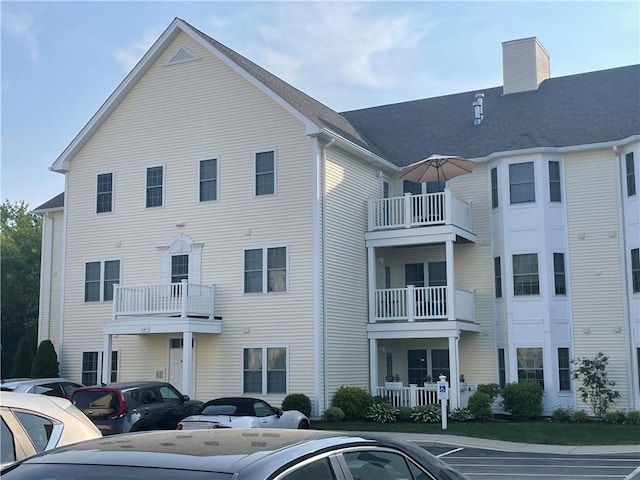 60 Saw Mill Dr Unit 303, North Kingstown, RI 02852 - view of building exterior with uncovered parking