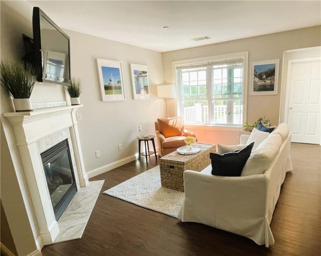 60 Saw Mill Dr Unit 303, North Kingstown, RI 02852 - living area featuring wood finished floors, baseboards, and a premium fireplace