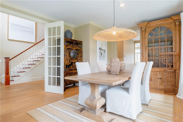 62 James Ct, Portsmouth, RI 02871 - dining room featuring light wood-style floors, stairway, and ornamental molding