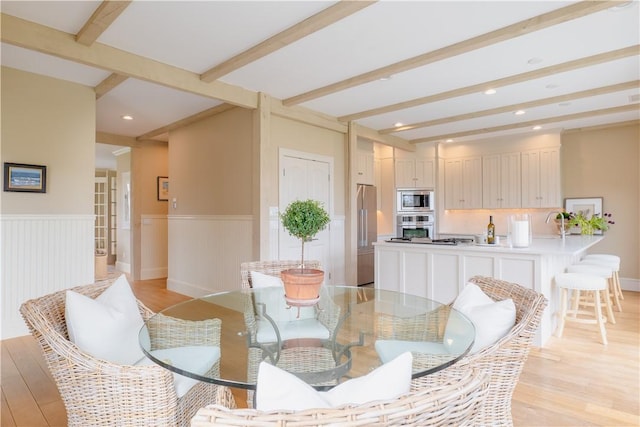 62 James Ct, Portsmouth, RI 02871 - dining space featuring beamed ceiling, light wood finished floors, a wainscoted wall, and recessed lighting