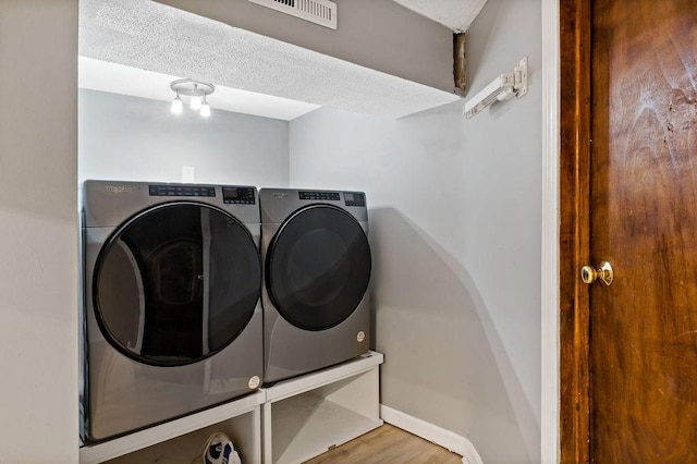 47 Morgan Ave Unit 45, Johnston, RI 02919 - washroom featuring separate washer and dryer, wood finished floors, and baseboards