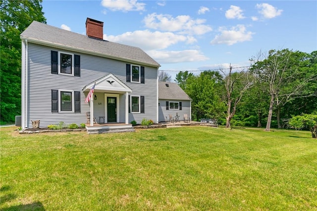 529 Rocky Hill Rd, Scituate, RI 02857 - colonial inspired home featuring a chimney, a front yard, and a shingled roof
