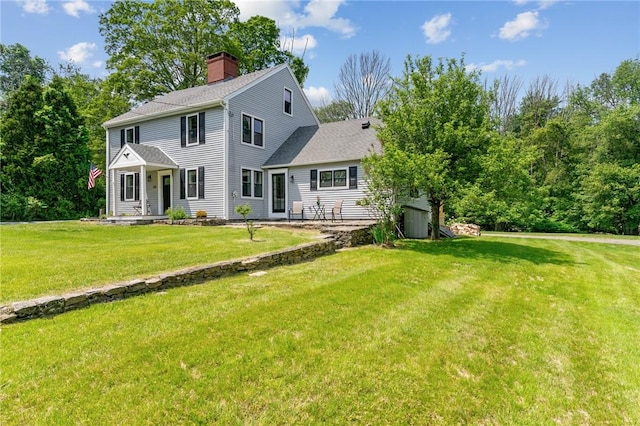 529 Rocky Hill Rd, Scituate, RI 02857 - view of front of house featuring a chimney, a front lawn, and a shingled roof
