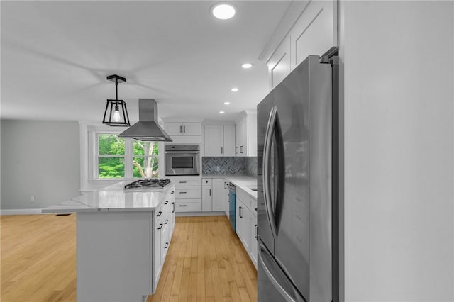 529 Rocky Hill Rd, Scituate, RI 02857 - kitchen with appliances with stainless steel finishes, exhaust hood, white cabinetry, tasteful backsplash, and recessed lighting