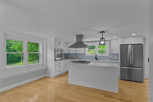529 Rocky Hill Rd, Scituate, RI 02857 - kitchen featuring stainless steel appliances, island range hood, baseboards, white cabinets, and a kitchen island