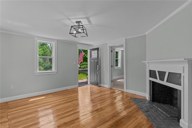 529 Rocky Hill Rd, Scituate, RI 02857 - unfurnished living room with wood finished floors, baseboards, ornamental molding, and a fireplace