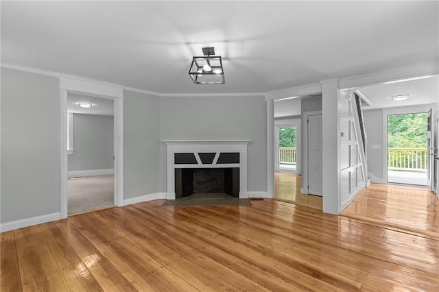 529 Rocky Hill Rd, Scituate, RI 02857 - unfurnished living room featuring light wood-style floors, healthy amount of natural light, crown molding, and baseboards