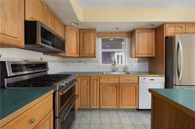 30 Walden Way S, Kingstown, RI 02879 - kitchen with appliances with stainless steel finishes, a sink, decorative backsplash, light tile patterned floors, and recessed lighting