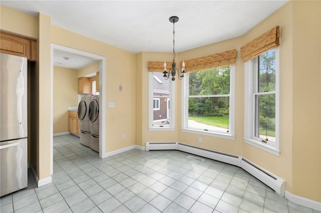 30 Walden Way S, Kingstown, RI 02879 - unfurnished dining area featuring washer and clothes dryer, a chandelier, baseboards, light tile patterned floors, and a baseboard heating unit