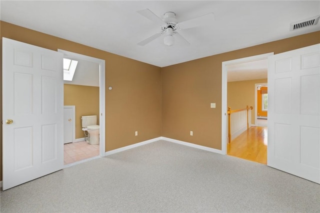 30 Walden Way S, Kingstown, RI 02879 - unfurnished bedroom with carpet flooring, a skylight, baseboards, and connected bathroom