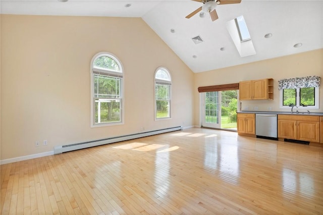 30 Walden Way S, Kingstown, RI 02879 - unfurnished living room with a baseboard heating unit, high vaulted ceiling, light wood-type flooring, a ceiling fan, and a skylight