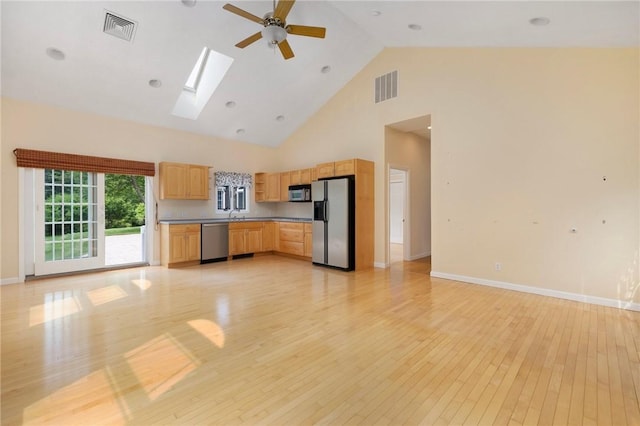 30 Walden Way S, Kingstown, RI 02879 - kitchen featuring appliances with stainless steel finishes, light brown cabinetry, light wood-type flooring, a ceiling fan, and high vaulted ceiling