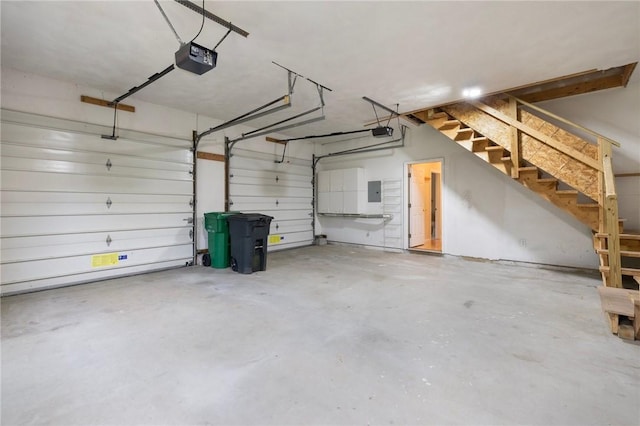 30 Walden Way S, Kingstown, RI 02879 - garage featuring a garage door opener and electric panel