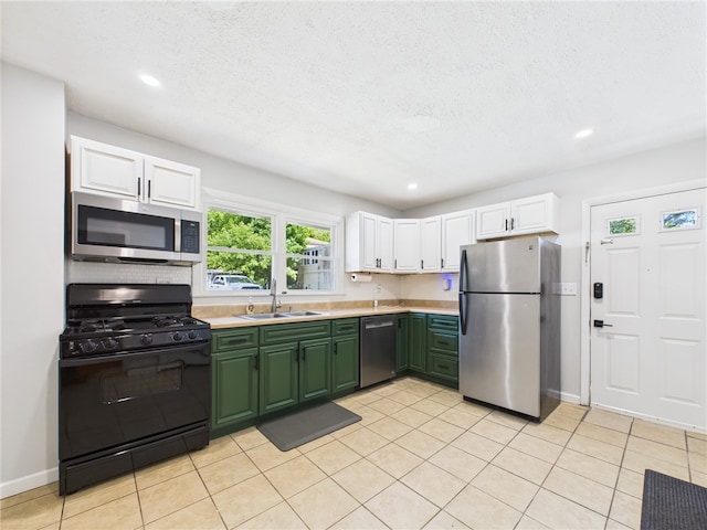 5 Conca St, North Providence, RI 02904 - kitchen featuring stainless steel appliances, a sink, green cabinets, white cabinetry, and light countertops