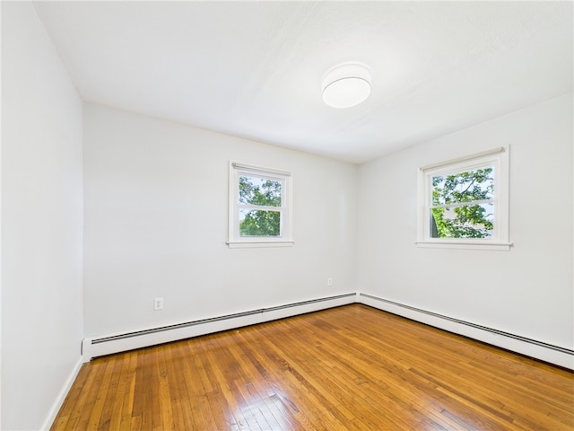 5 Conca St, North Providence, RI 02904 - unfurnished room with healthy amount of natural light, baseboard heating, hardwood / wood-style flooring, and baseboards