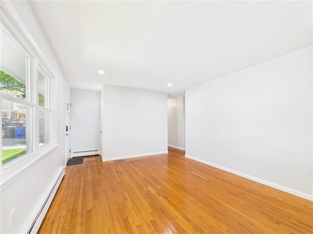 5 Conca St, North Providence, RI 02904 - unfurnished room with baseboard heating, light wood-style floors, baseboards, and recessed lighting