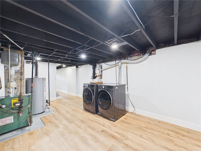 5 Conca St, North Providence, RI 02904 - finished below grade area featuring washer and clothes dryer, gas water heater, wood finished floors, and baseboards