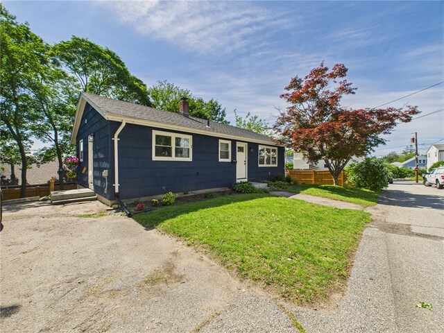 5 Conca St, North Providence, RI 02904 - view of front facade featuring a chimney and roof with shingles