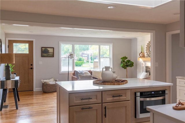 24 W Knollwood Cir, North Kingstown, RI 02852 - kitchen featuring oven, light countertops, light wood-style flooring, plenty of natural light, and recessed lighting
