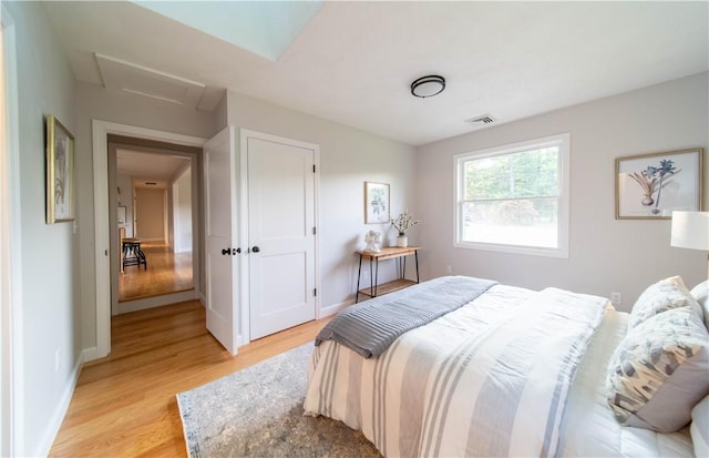 24 W Knollwood Cir, North Kingstown, RI 02852 - bedroom with attic access, light wood-style floors, and baseboards
