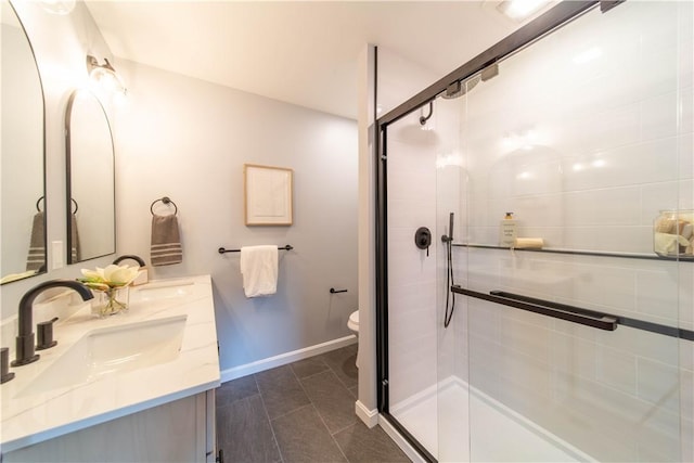24 W Knollwood Cir, North Kingstown, RI 02852 - full bathroom with double vanity, a shower stall, toilet, and baseboards