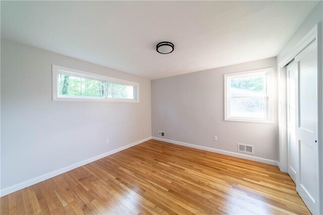 24 W Knollwood Cir, North Kingstown, RI 02852 - unfurnished bedroom with light wood-style flooring, baseboards, and a closet