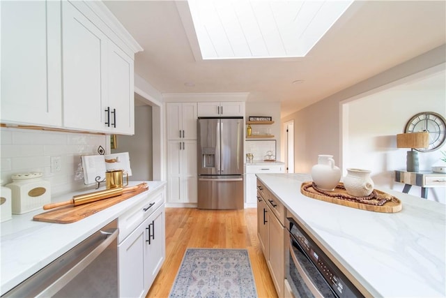 24 W Knollwood Cir, North Kingstown, RI 02852 - kitchen with stainless steel refrigerator with ice dispenser, decorative backsplash, light wood-type flooring, and white cabinets