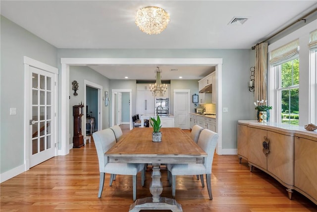 171 Leeshore Ln, Tiverton, RI 02878 - dining space with a chandelier, light wood finished floors, baseboards, and recessed lighting