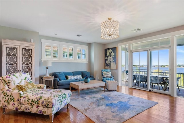 171 Leeshore Ln, Tiverton, RI 02878 - living area featuring a chandelier and wood finished floors