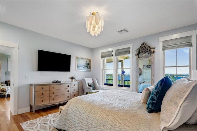171 Leeshore Ln, Tiverton, RI 02878 - bedroom with multiple windows, wood finished floors, and baseboards