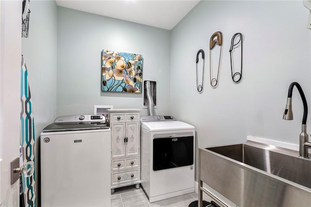 171 Leeshore Ln, Tiverton, RI 02878 - laundry area featuring separate washer and dryer and light tile patterned floors