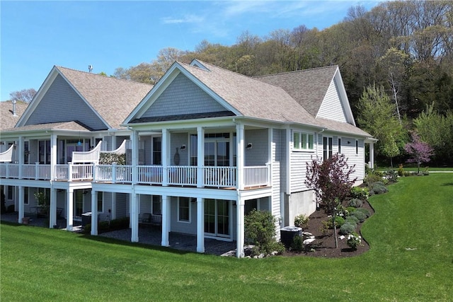 171 Leeshore Ln, Tiverton, RI 02878 - back of property featuring a shingled roof and a yard