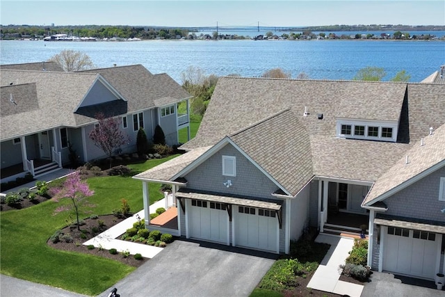 171 Leeshore Ln, Tiverton, RI 02878 - view of front of house with roof with shingles, asphalt driveway, a water view, and a garage
