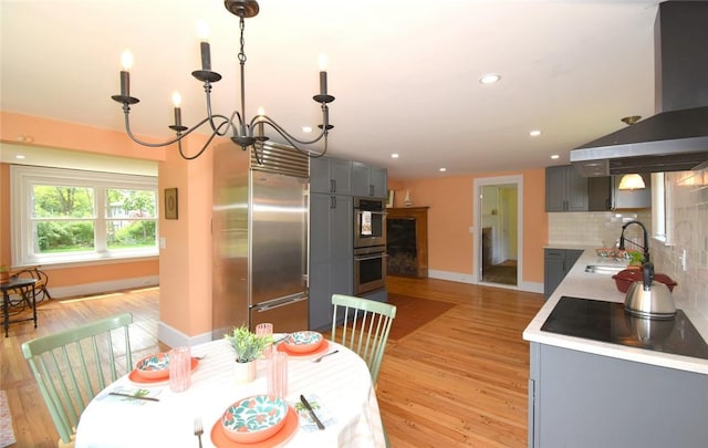 259 Green Hill Beach Rd, South Kingstown, RI 02879 - kitchen featuring a sink, gray cabinetry, appliances with stainless steel finishes, light wood-style flooring, and recessed lighting