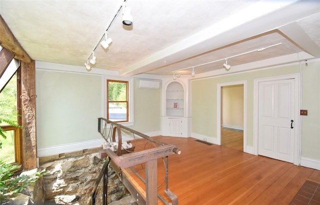 259 Green Hill Beach Rd, South Kingstown, RI 02879 - hall with track lighting, an AC wall unit, and plenty of natural light