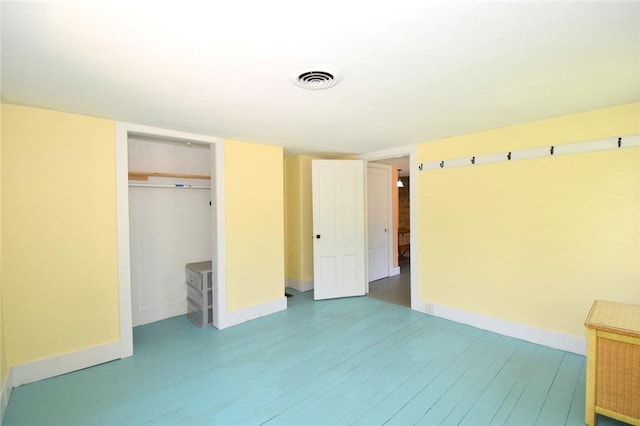 259 Green Hill Beach Rd, South Kingstown, RI 02879 - unfurnished bedroom featuring wood finished floors, baseboards, and a closet