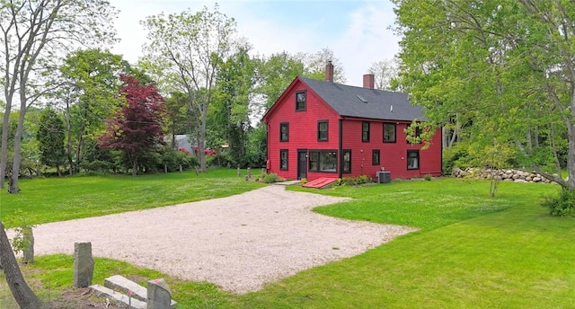 259 Green Hill Beach Rd, South Kingstown, RI 02879 - rear view of property with a chimney, cooling unit, and a yard