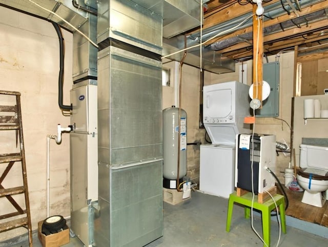 127 Pettey Ln, Westport, MA 02790 - utility room with stacked washer and clothes dryer