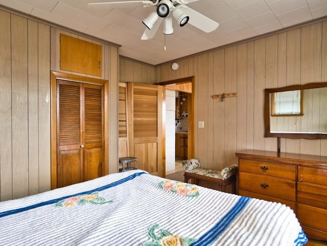 127 Pettey Ln, Westport, MA 02790 - bedroom featuring wood walls, a closet, and ceiling fan