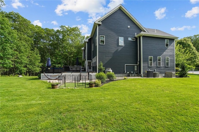 40 Oakbrook Ct, East Greenwich, RI 02818 - rear view of property featuring a patio, a yard, and cooling unit