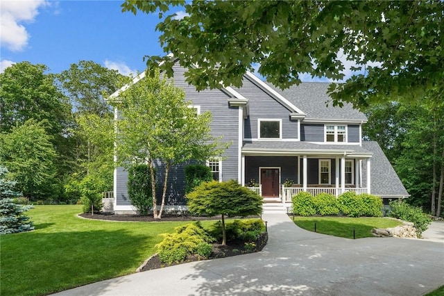 40 Oakbrook Ct, East Greenwich, RI 02818 - view of front of home featuring covered porch and a front lawn