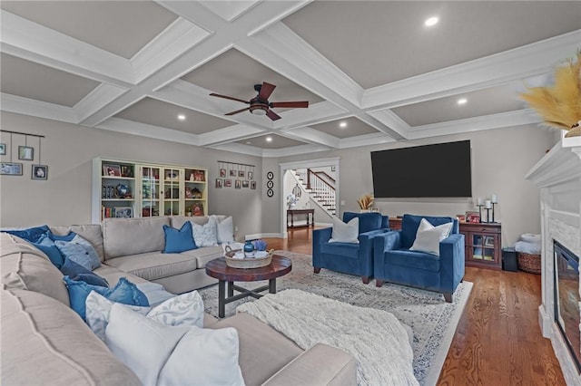 40 Oakbrook Ct, East Greenwich, RI 02818 - living area with stairs, wood finished floors, a glass covered fireplace, beamed ceiling, and ceiling fan