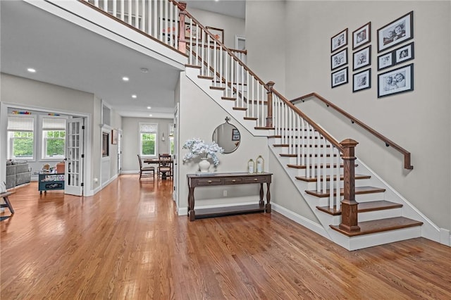 40 Oakbrook Ct, East Greenwich, RI 02818 - stairs featuring wood finished floors, baseboards, french doors, and recessed lighting