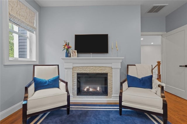 40 Oakbrook Ct, East Greenwich, RI 02818 - living area with wood finished floors, a fireplace, and baseboards