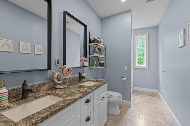 40 Oakbrook Ct, East Greenwich, RI 02818 - full bathroom with toilet, double vanity, and baseboards