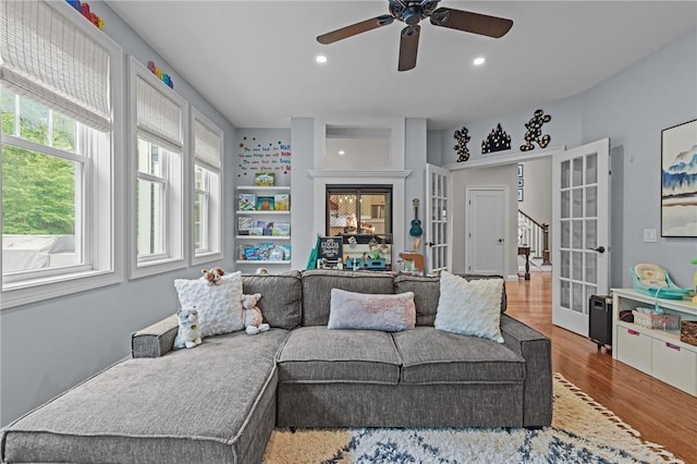 40 Oakbrook Ct, East Greenwich, RI 02818 - living area with wood finished floors, ceiling fan, recessed lighting, and french doors