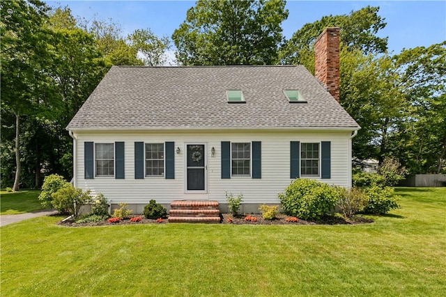 17 Basswood Dr, Bristol, RI 02809 - new england style home with a chimney, a front yard, and roof with shingles